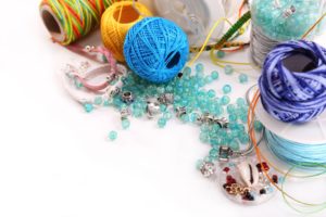 Braided bracelet, colored threads, beads and various attributes