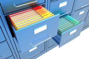 Folders in the open file cabinet